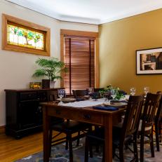 Craftsman Dining Room Features Warm Gold Accent Wall