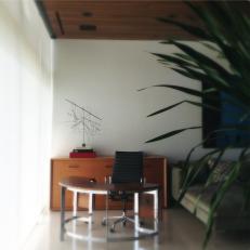 Modern Office With Small Wrap-Around Desk and Swivel Chair