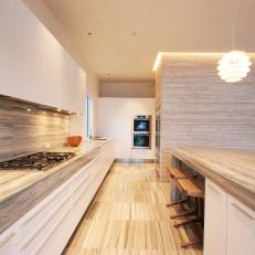 Neutral Modern Kitchen With Long Stone Countertops
