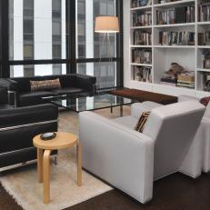 Urban Contemporary Living Room With Wall of Built-in Shelves