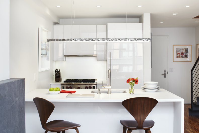 Small White Kitchen With Breakfast Bar & Wooden Barstools