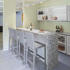 Speckled Bar With White Barstools