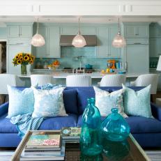 Transitional Open Plan Kitchen and Living Area With Blue Sofa