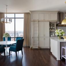Neutral Urban Open Plan Dining Area With Blue Chairs