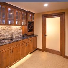 Craftsman Wet Bar With Frosted Glass Upper Cabinets