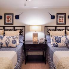 Coastal Inspired Bedroom Featuring Indigo Blue and White Bed Linens