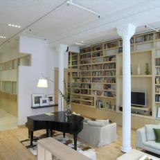 Transitional Living Room With Large Bookshelf