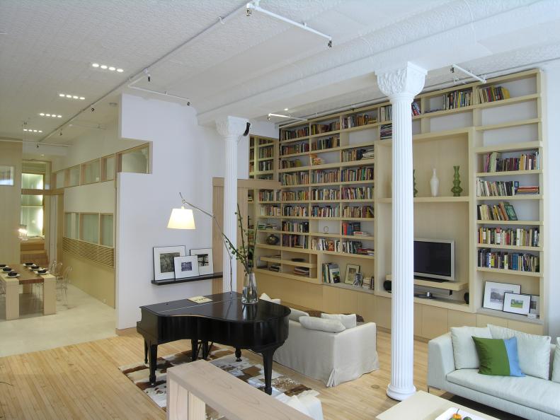 White Living Room With Large Bookshelf