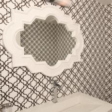 Angled Bathroom Sink With Graphic Wallpaper and Moroccan Mirror 