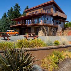 Sunny Winery Home With Wrap Around Porch, Large Driveway and Mixed Textures 