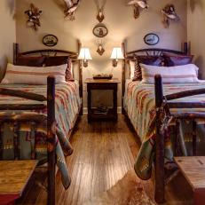 Lodge-Style Bedroom Boasts Mounted Birds and Log Beds