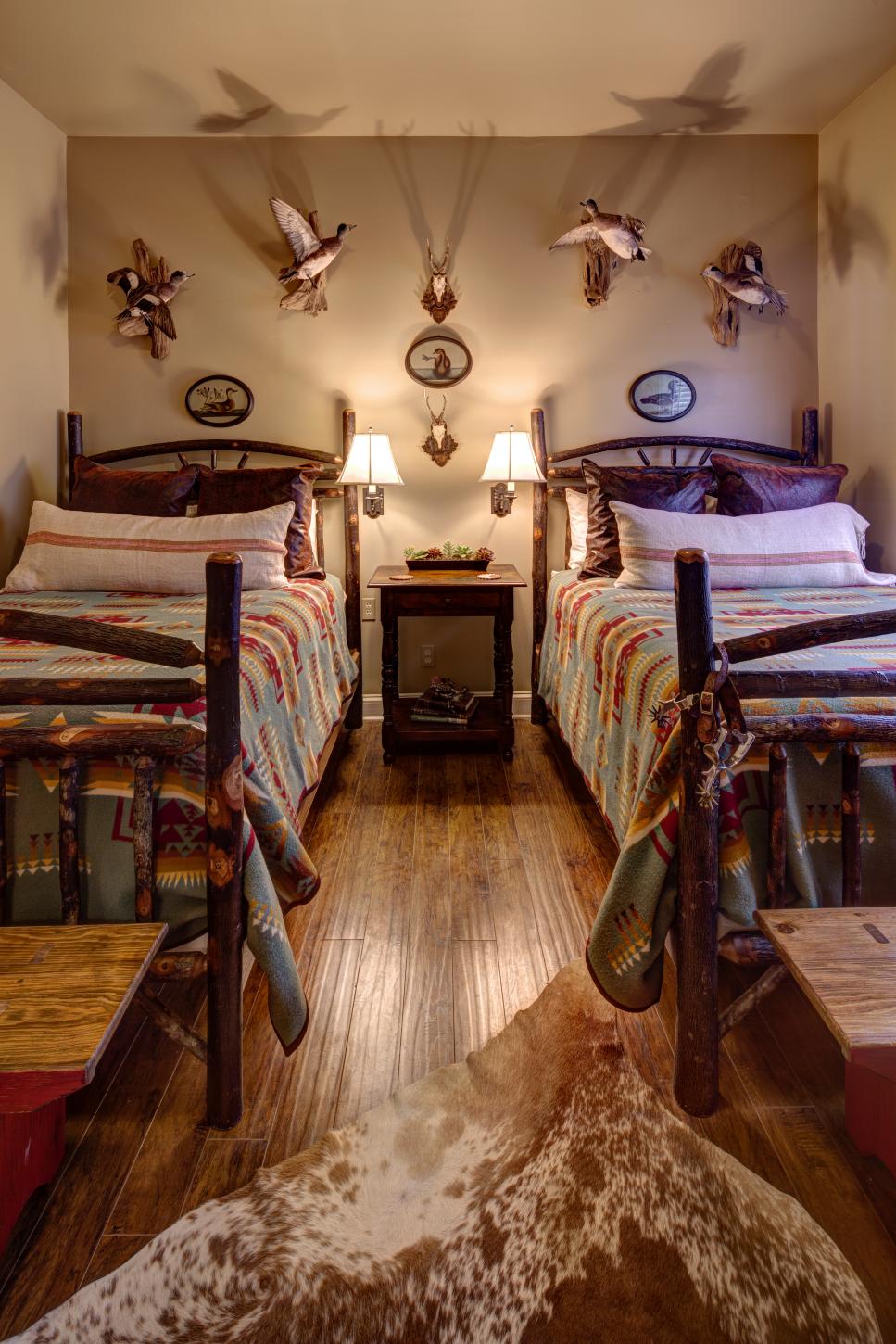 Lodge-Style Bedroom Boasts Mounted Birds and Log Beds | HGTV