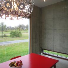 Cement Dining Room With Mod Red Table