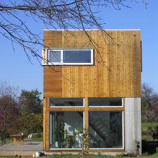 Contemporary Home Facade With Wood Siding