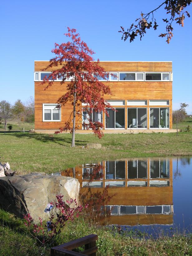 Modern Home Facade With Garden and Pond