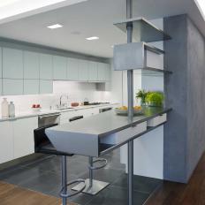 Gray and White Modern Kitchen With Eating Bar