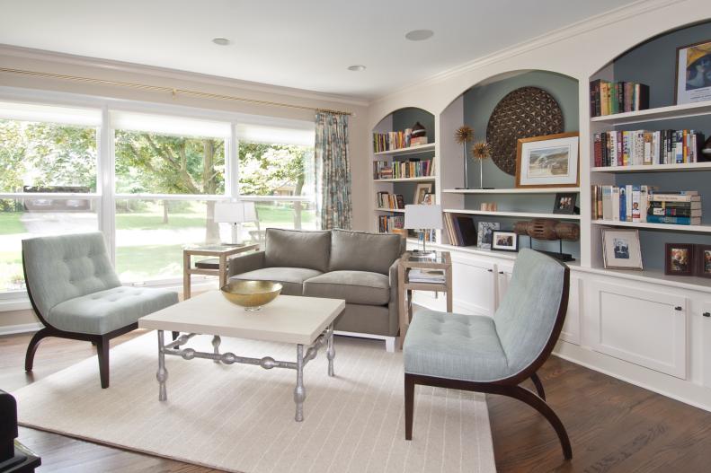 Neutral Sitting Room With Built-In Bookshelves, Mix of Seating