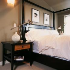 Neutral Transitional Bedroom With Black Canopy Bed