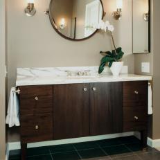 Wood Vanity With White Marble Countertops and Mirror