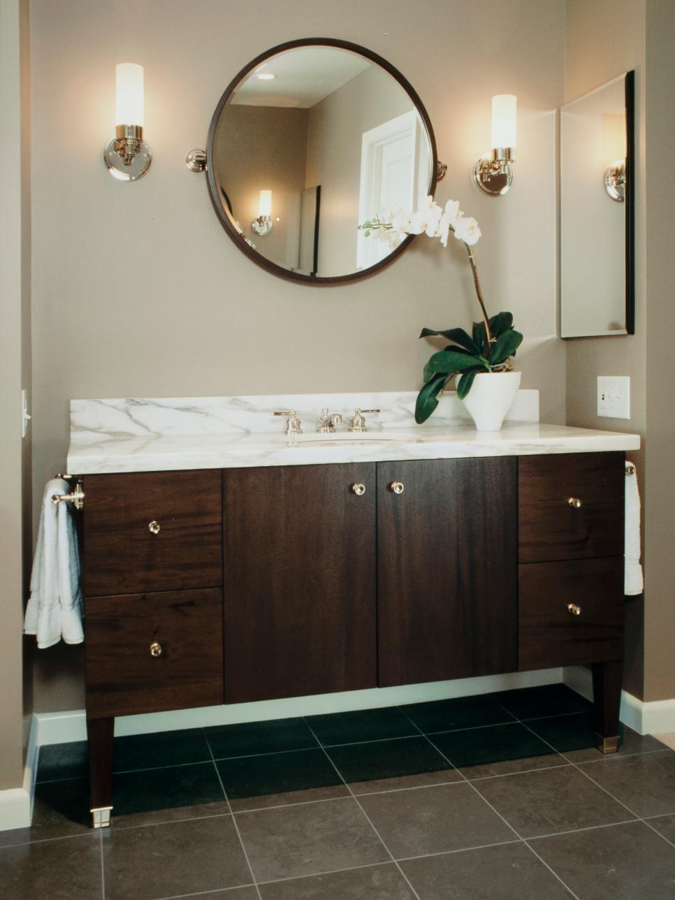 Wood Vanity With White Marble Countertops and Mirror | HGTV