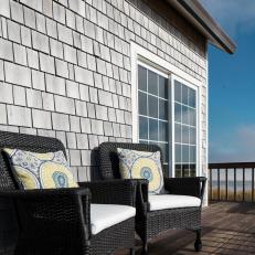 Coastal Deck With Black Wicker Armchairs