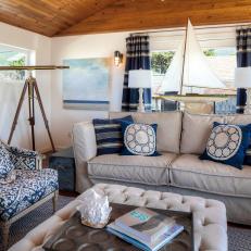 Blue and White Coastal Living Room With Sailboat
