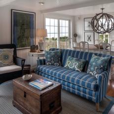 Blue and White Coastal Living Room With Blue Sofa