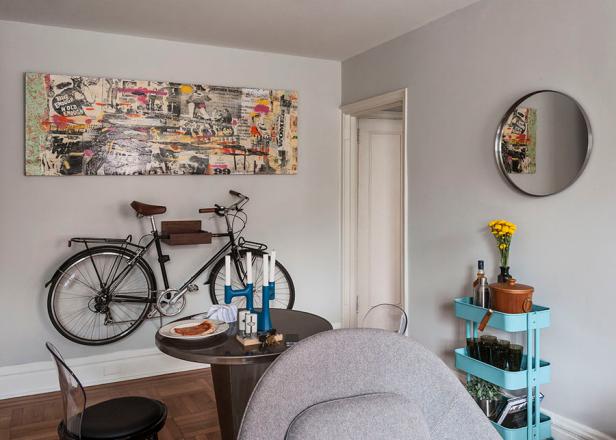 Neutral Living Space With Eclectic Art & Mounted Bike