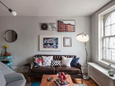 Gray Living Room With Leather Sofa, Metallic Floor Lamp