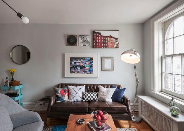 Gray Living Room With Leather Sofa, Metallic Floor Lamp