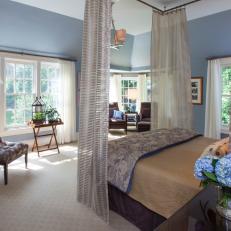 Soft Blue Master Suite With Tufted Leather Chair