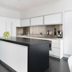 Modern White Kitchen With Stainless Steel Countertop