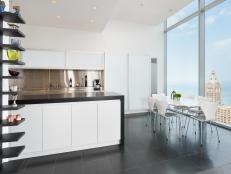 White Kitchen With City View & Black Tile Floor
