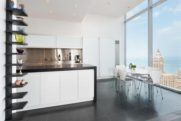 White Kitchen With City View & Black Tile Floor