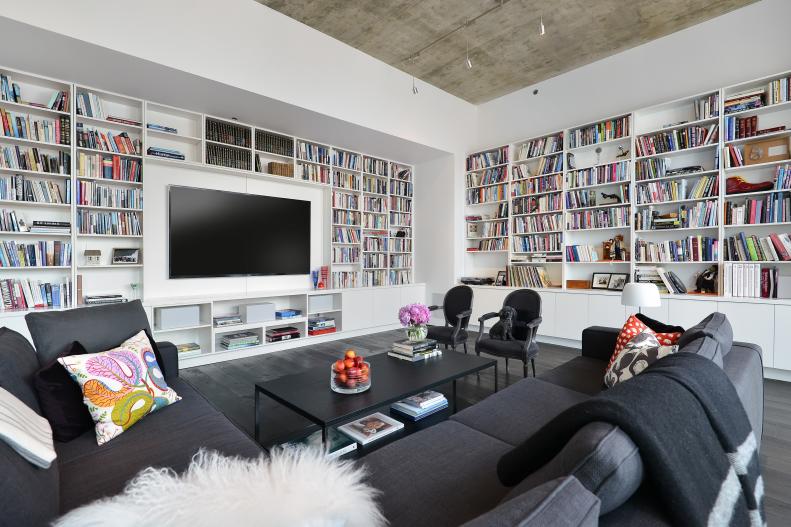 White Living Room With Built-In Bookshelves, Gray Sectional, TV