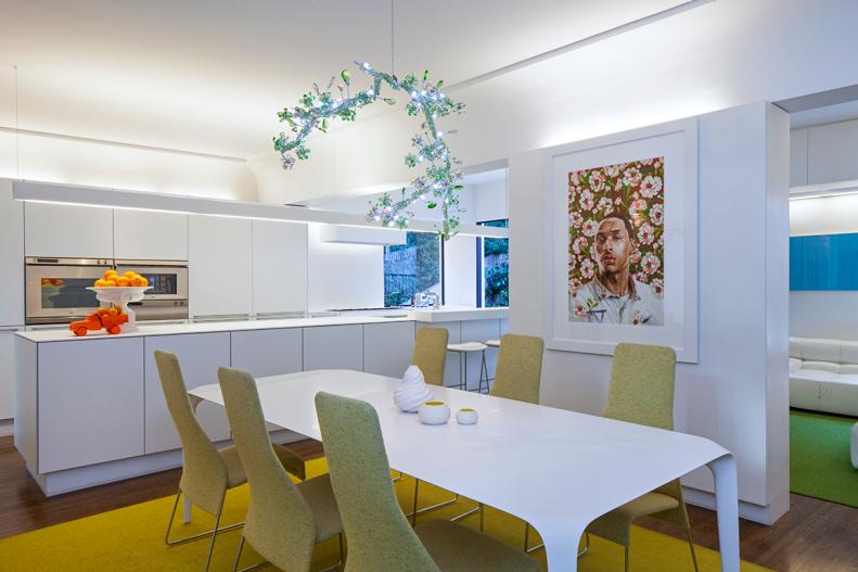 Contemporary White Kitchen With Green Upholstered Dining Chairs