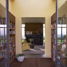 Modern Yellow Entry Doubles as Home Library