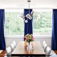 White Contemporary Dining Room With Blue Curtains