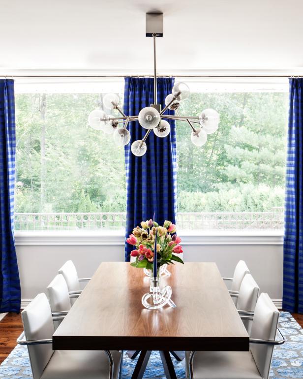 White Contemporary Dining Room With Blue Curtains | HGTV