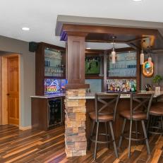 Basement Bar Features Plenty Of Storage, Shelf Space, Seating & Marble Countertop