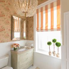 Charming Guest Bathroom With Chandelier and Floral Wallpaper