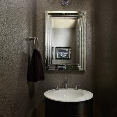 Sparkling Contemporary Bathroom With Glittering Walls, Circular Vanity and Black Shaded Sconce