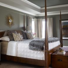 Stylish Master Bedroom Featuring Gray Tones, Pointed Wood Post Bed Frame and Faux Fur Accent Throw