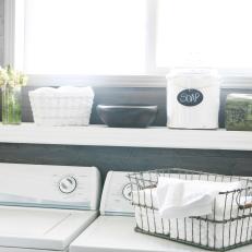 Laundry Room With Stylish Storage Containers