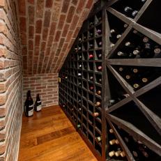 Basement Wine Cellar With Exposed Red Brick Wall