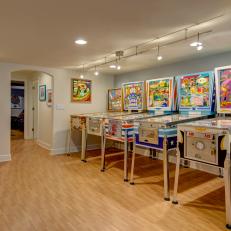 Vintage Pinball Machines in Whimsical Basement