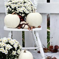 Vintage Chair Arrangement of White Pumpkins and Mums