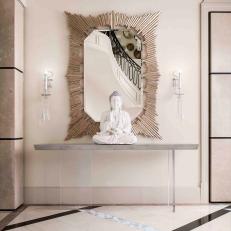 Contemporary Hall With Metallic Mirror and Buddha Sculpture
