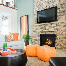 Contemporary Teal Living Room With Stacked Stone Fireplace
