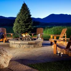 A Rustic Fire Pit At A Mountain Home
